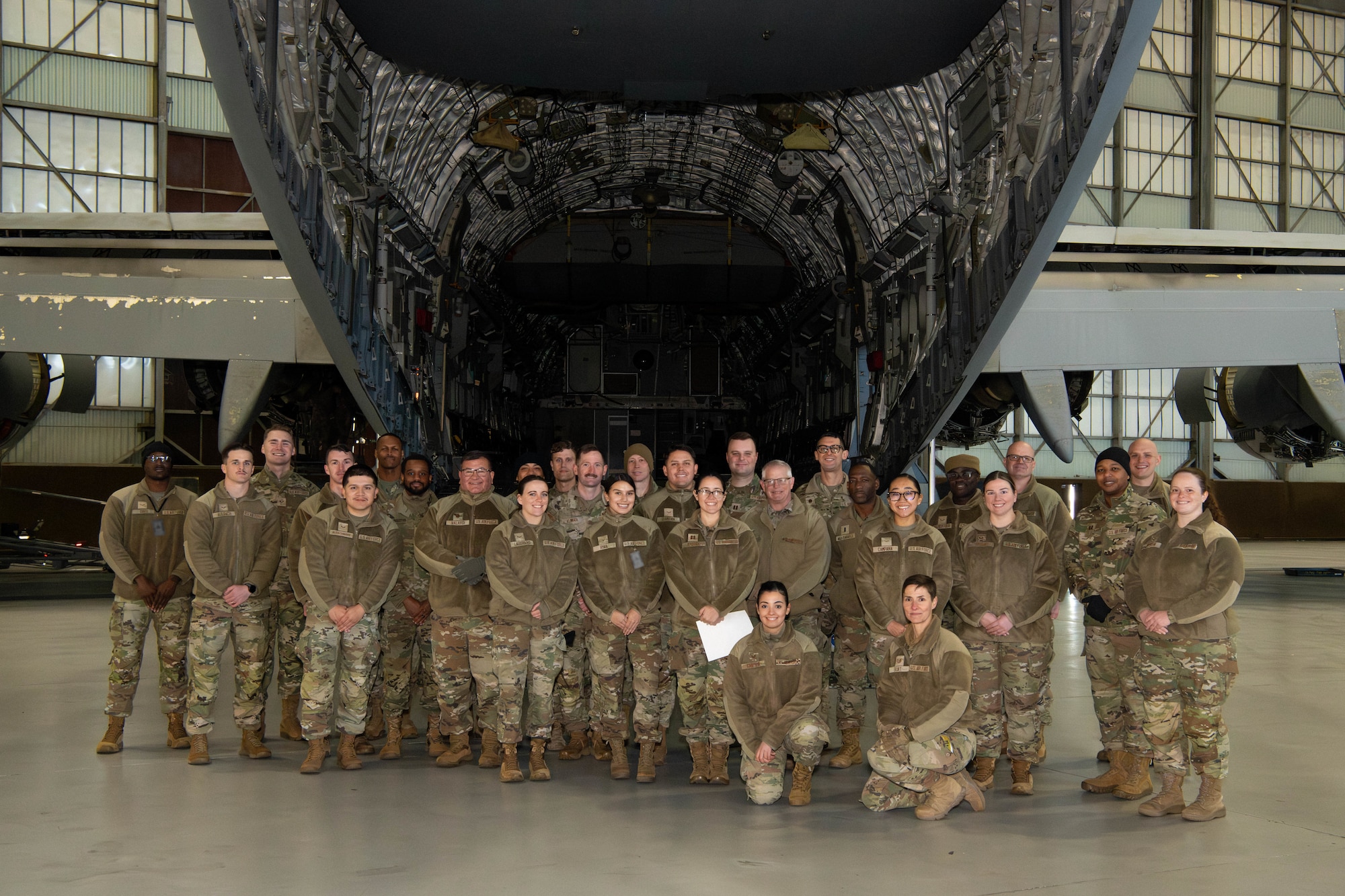 A photo of Airmen standing in front of a C-17 Globemaster III.