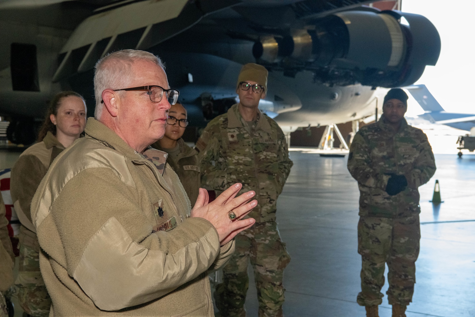 A photo of Lt. Col Richard Holmes addressing a group of Airmen.