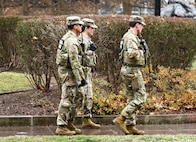 U.S. Army Spc. Ethan Shumar, a combat engineer, front, U.S. Air National Guard Capt. April McClung, a nurse, and U.S. Army Pfc. Jalen Taylor, a unit supply specialist, all assigned to the West Virginia National Guard, patrol near the Judiciary Square Metro station, Jan. 9, 2026. About 2,500 National Guard members support the D.C. Safe and Beautiful mission, assisting the Metropolitan Police Department in maintaining public safety for residents, commuters and visitors throughout the District. (U.S. Air National Guard photo by Tech. Sgt. Melissa Sterling)