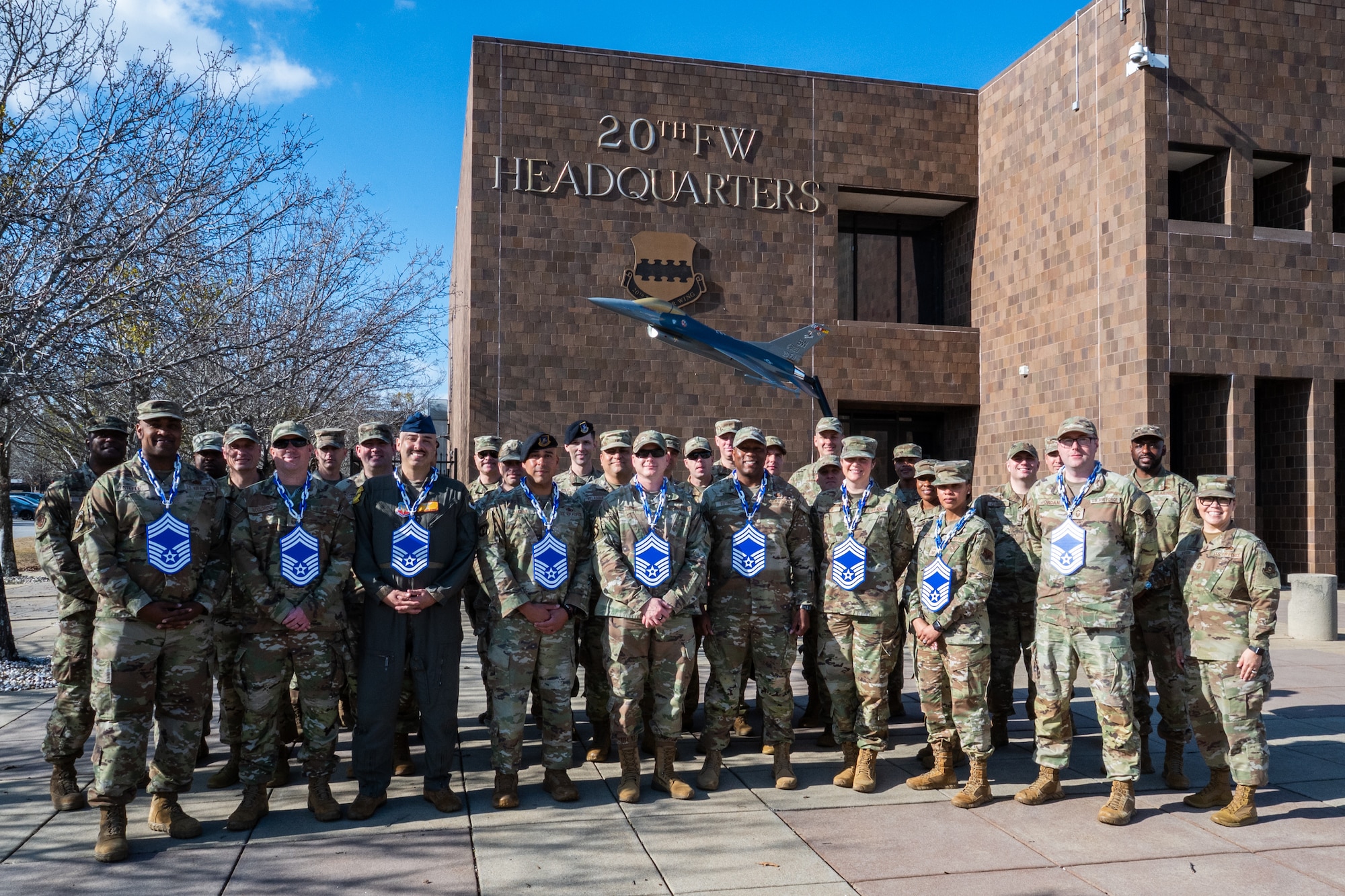 A group of military members pose for a picture