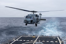 A U.S Navy MH-60R Sea Hawk, assigned to Helicopter Maritime Strike Squadron (HSM) 51, takes off from the flight deck of Arleigh Burke-class guided-missile destroyer USS Rafael Peralta (DDG 115) in the North Pacific Ocean, Jan. 7, 2025. Rafael Peralta is forward deployed and assigned to Destroyer Squadron (DESRON) 15, the Navy's largest DESRON and the U.S. 7th Fleet's principal surface force. (U.S. Navy photo by Mass Communication Specialist 1st Class Ryre Arciaga)