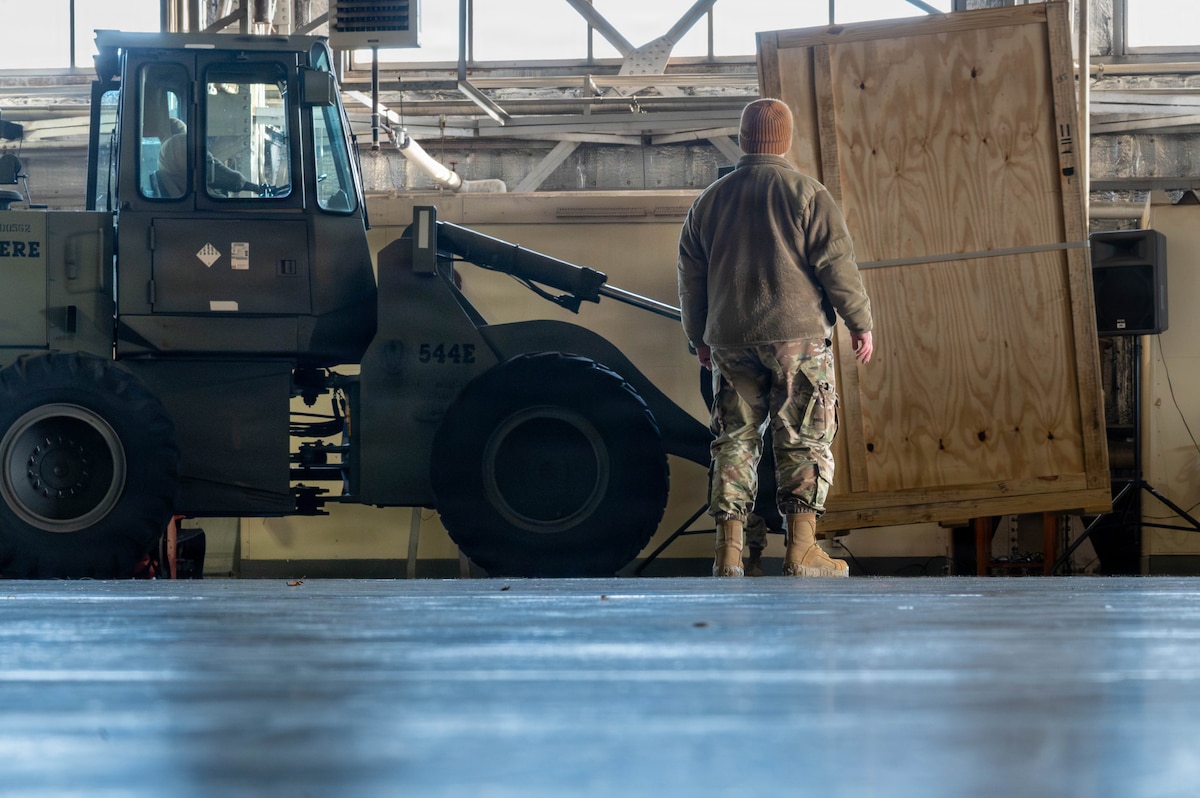 U.S. Air Force Master Sgt. Dustin Grantom, right, 13th Fighter Squadron support section chief, and U.S. Air Force Staff Sgt. Ardo Dia, 13th Fighter Squadron support supervisor, coordinate cargo movement with a forklift at Misawa Air Base, Japan, Jan. 7, 2025. The delivery of F-35A Lightning II support equipment marks a key milestone in the 35th Fighter Wing’s transition to fifth-generation aircraft to enhance security throughout the Indo-Pacific region. (U.S. Air Force photo by Airman 1st Class Jessel Fabara)