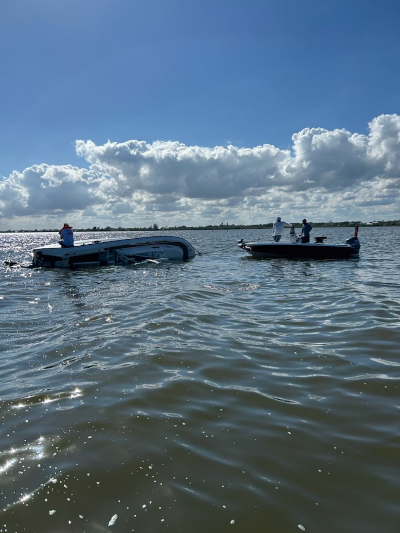 A Coast Guard Station Port Canaveral boat crew rescues a person after their 24-foot vessel capsized on the Banana River near Kelly Park in Port Canaveral, Florida, Jan. 10, 2026.
