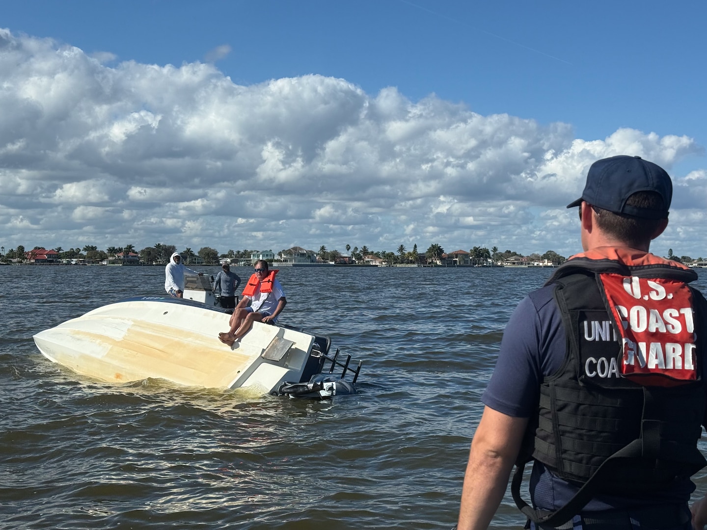 A Coast Guard Station Port Canaveral boat crew rescues a person after their 24-foot vessel capsized on the Banana River near Kelly Park in Port Canaveral, Florida, Jan. 10, 2026.