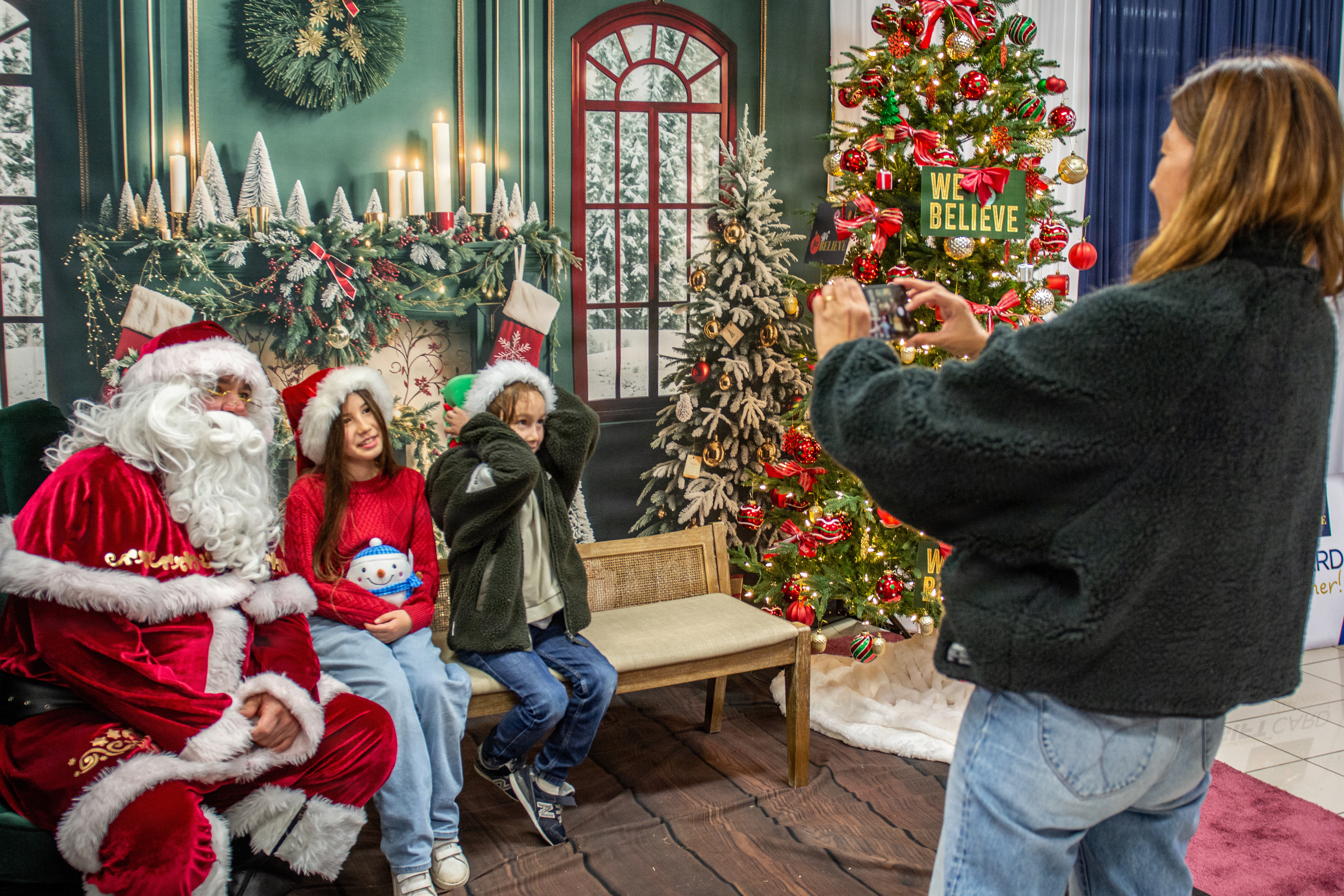 Santa Claus posed for photos at Yokosuka Navy Exchange's Santa Pajama Party at the Ikego Mini-Mart in Ikego Heights Family Housing Area.