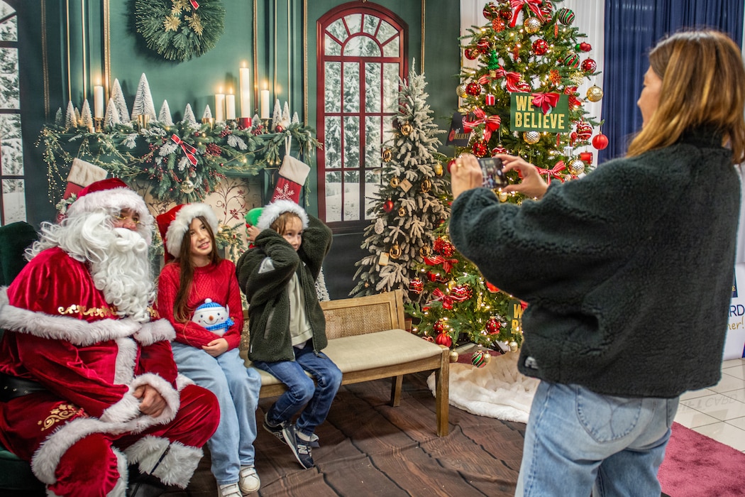 Santa Claus posed for photos at Yokosuka Navy Exchange's Santa Pajama Party at the Ikego Mini-Mart in Ikego Heights Family Housing Area.