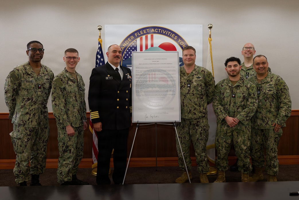 Capt. Jon Hopkins, Commander, Fleet Activities Yokosuka (CFAY), poses for a photo with chaplains and Religious Program Specialists assigned to CFAY’s Chapel of Hope after signing the Spiritual Readiness Proclamation at CFAY headquarters, Jan. 6, 2026.
