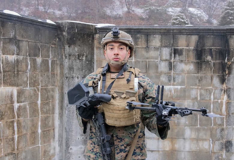 U.S. Marine Corps Lance Cpl. Aaron Duran, left, and Lance Cpl. Juan Hilario, both machine gunners with 1st Battalion, 6th Marines, forward deployed with 4th Marine Regiment, 3rd Marine Division as part of the Unit Deployment Program, fire on simulated adversary forces with an M240B machine gun while conducting platoon attacks in an urban environment during Korea Viper 26.1 at Camp Rodriguez, South Korea, Dec. 17, 2025. Korea Viper is a recurring exercise series that demonstrates the Republic of Korea and U.S. Marine Corps' ability to respond decisively in the region as a singular, unified force while strengthening relationships and trust between the two allies. Duran is a native of California, and Hilario is a native of Illinois. (U.S. Marine Corps photo by Cpl. John Simpson)