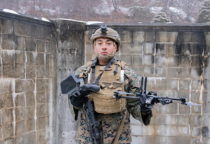 U.S. Marine Corps Lance Cpl. Aaron Duran, left, and Lance Cpl. Juan Hilario, both machine gunners with 1st Battalion, 6th Marines, forward deployed with 4th Marine Regiment, 3rd Marine Division as part of the Unit Deployment Program, fire on simulated adversary forces with an M240B machine gun while conducting platoon attacks in an urban environment during Korea Viper 26.1 at Camp Rodriguez, South Korea, Dec. 17, 2025. Korea Viper is a recurring exercise series that demonstrates the Republic of Korea and U.S. Marine Corps' ability to respond decisively in the region as a singular, unified force while strengthening relationships and trust between the two allies. Duran is a native of California, and Hilario is a native of Illinois. (U.S. Marine Corps photo by Cpl. John Simpson)