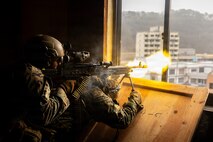 U.S. Marine Corps Lance Cpl. Aaron Duran, left, and Lance Cpl. Juan Hilario, both machine gunners with 1st Battalion, 6th Marines, forward deployed with 4th Marine Regiment, 3rd Marine Division as part of the Unit Deployment Program, fire on simulated adversary forces with an M240B machine gun while conducting platoon attacks in an urban environment during Korea Viper 26.1 at Camp Rodriguez, South Korea, Dec. 17, 2025. Korea Viper is a recurring exercise series that demonstrates the Republic of Korea and U.S. Marine Corps' ability to respond decisively in the region as a singular, unified force while strengthening relationships and trust between the two allies. Duran is a native of California, and Hilario is a native of Illinois. (U.S. Marine Corps photo by Cpl. John Simpson)