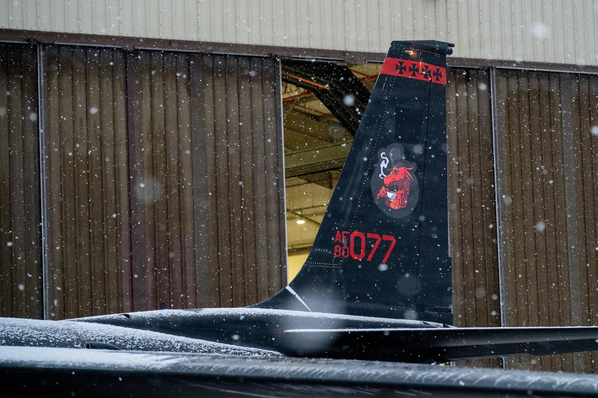 The tail of a U-2 Dragon Lady aircraft assigned to the 99th Expeditionary Reconnaissance Squadron is visible during ground operations