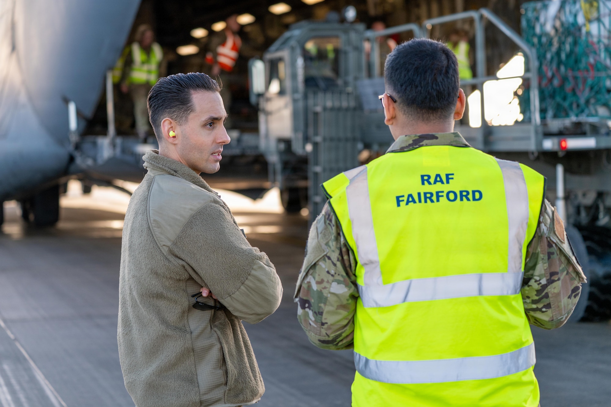 U.S. Air Force Master Sgt. Michael Barbato, 420th Air Base Squadron logistics readiness flight chief, speaks with Senior Airman Carlos Vargas, 420th ABS ground transportation operator, during Project MACE