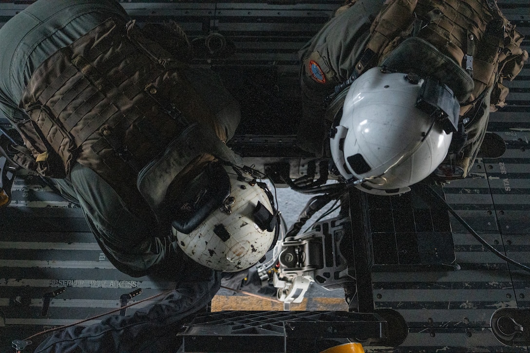 U.S. Marines with Marine Heavy Helicopter Training Squadron (HMHT) 302, Marine Aircraft Group 29, 2nd Marine Aircraft Wing, prepare a CH-53K King Stallion helicopter for external lifts before an initial accession flight at Marine Corps Air Station New River, North Carolina, Dec. 18, 2025. HMHT-302 provides foundational training for new CH-53K pilots arriving from flight school and for pilots and aircrew transitioning from the CH-53E Super Stallion helicopter. (U.S. Marine Corps photo by Staff Sgt. Maximiliano Rosas)
