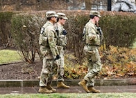 U.S. Army Spc. Ethan Shumar, a combat engineer, front; U.S. Air National Guard Capt. April McClung, a nurse; and U.S. Army Pfc. Jalen Taylor, a unit supply specialist, all assigned to the West Virginia National Guard, patrol near the Judiciary Square Metro station, Jan. 9, 2026.