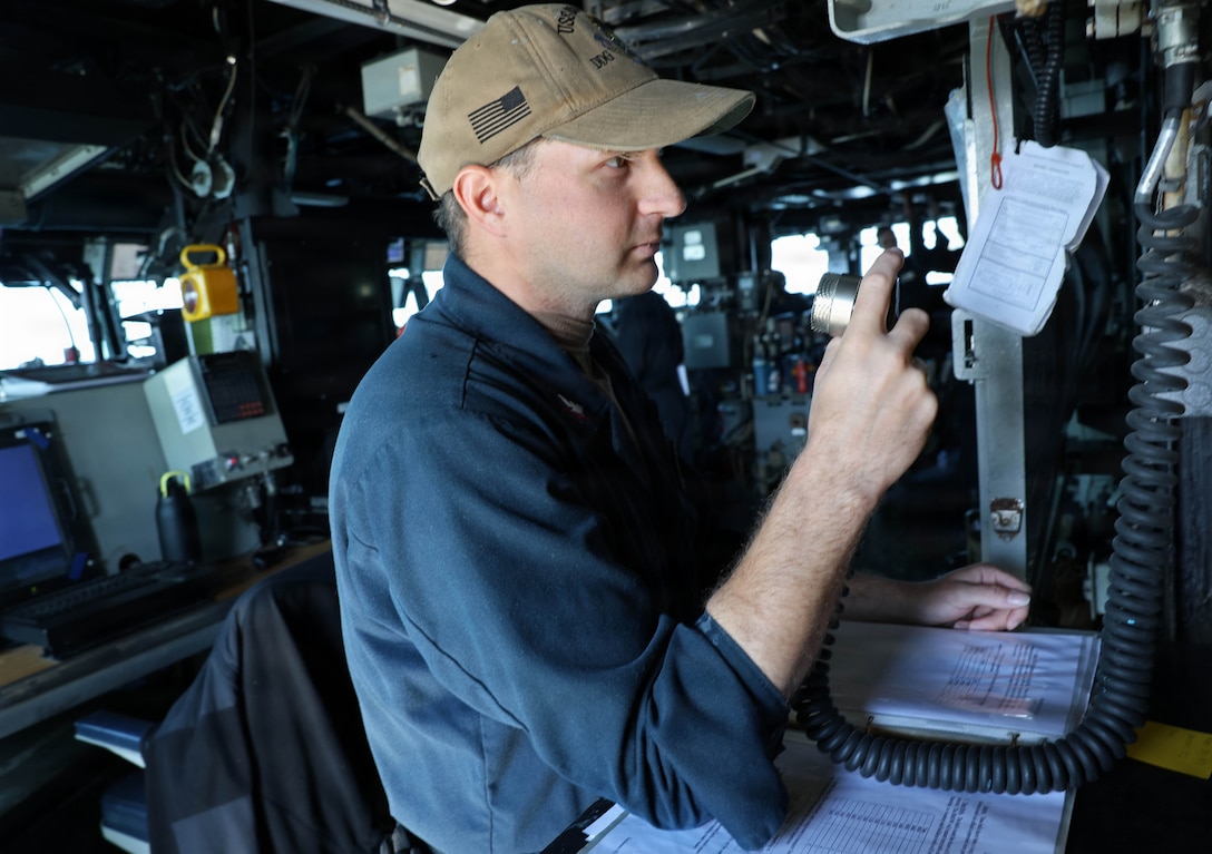 ARABIAN GULF (Jan. 11, 2026) U.S. Navy Boatswain's Mate 3rd Class Brandon Cunningham, assigned to the Arleigh Burke-class guided-missile destroyer USS Roosevelt (DDG 80), stands watch in the pilothouse during a transit in the Arabian Gulf. Roosevelt is deployed to the U.S. 5th Fleet area of operations to support maritime security and stability in the U.S. Central Command area of responsibility. (U.S. Navy photo by Mass Communication Specialist 1st Class Indra Beaufort)