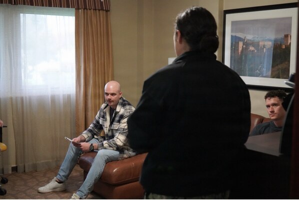 251210-N-FT324-6942. ROTA, Spain (December 10, 2025) – Lt. Cmdr. Erin Larroque, a clinical psychologist assigned to Navy Medicine Readiness and Training Command Rota, facilitates a guided discussion with recovered service members during a Survival, Evasion, Resistance, and Escape Phase II reintegration exercise. SERE training prepares members to survive isolation, resist exploitation, and safely return to friendly control. For medical staff, the training focused on psychological recovery, communication, and readiness following simulated isolation events (U.S. Navy Photo Taken by Lt. Cmdr. Alicia Sacks)