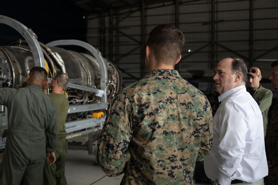 The Honorable John C. Phelan, secretary of the Navy, is briefed by the material control officer of Marine Fighter Attack Squadron (VMFA) 225, U.S. Marine Corps Forces, South, at Jose Aponte de la Torre Airport in Ceiba, Puerto Rico, Dec. 24, 2025. U.S. military forces are deployed to the Caribbean in support of the U.S. Southern Command mission, Department of War-directed operations and the president’s priorities to disrupt illicit drug trafficking and protect the homeland. (U.S. Marine Corps photo)