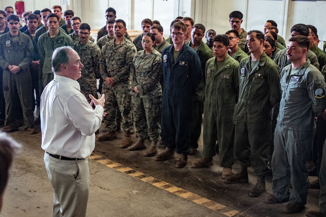 The Honorable John C. Phelan, secretary of the Navy, speaks to U.S. Marines with Marine Medium Tiltrotor Squadron (VMM) 263 (Reinforced), 22nd Marine Expeditionary Unit (Special Operations Capable), at Jose Aponte de la Torre Airport Ceiba, Puerto Rico, Dec. 24, 2025. U.S. military forces are deployed to the Caribbean in support of the U.S. Southern Command mission, Department of War-directed operations and the president’s priorities to disrupt illicit drug trafficking and protect the homeland. (U.S. Marine Corps photo)