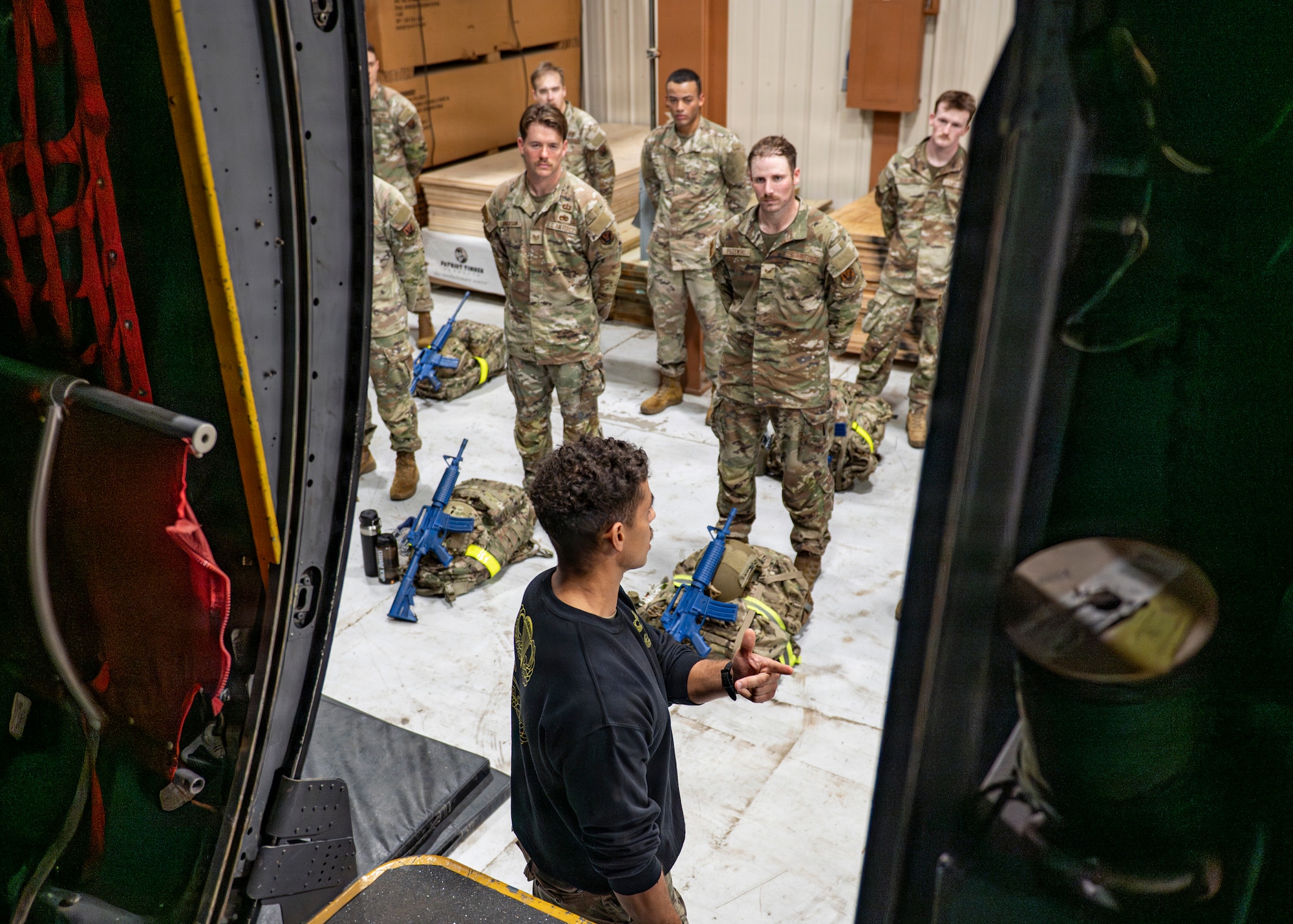 U.S. Air Force Capt. Luke Thomas, 23d Combat Air Base Squadron assistant director of operations, instructs Airmen assigned to the 23d CABS at Moody Air Force Base, Georgia, Jan. 7, 2026. The brief provided guidance and information before the second day of the assessment conducted to prepare volunteers for the physical demands of the Army Air Assault Course. (U.S. Air Force photo by Senior Airman Leonid Soubbotine)