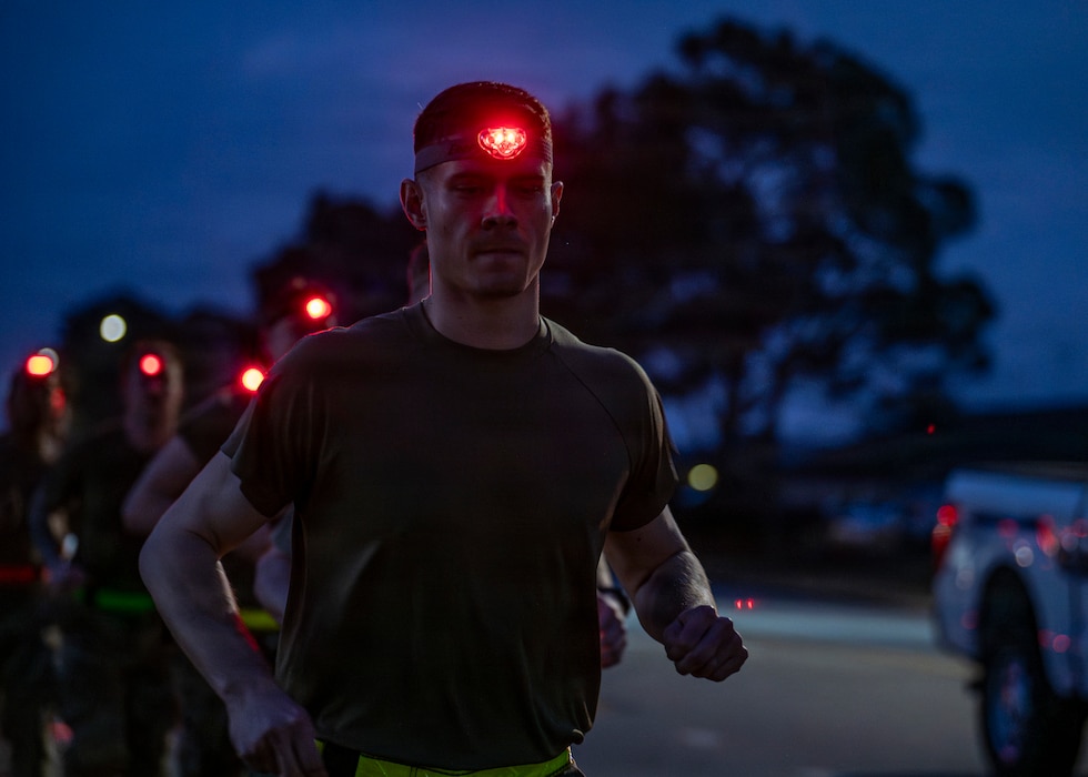 U.S. Air Force Airmen assigned to the 23d Combat Air Base Squadron run at Moody Air Force Base, Georgia, Jan. 7, 2026. The timed run was conducted as part of an assessment measuring physical readiness prior to attending the Army Air Assault Course. (U.S. Air Force photo by Senior Airman Leonid Soubbotine)