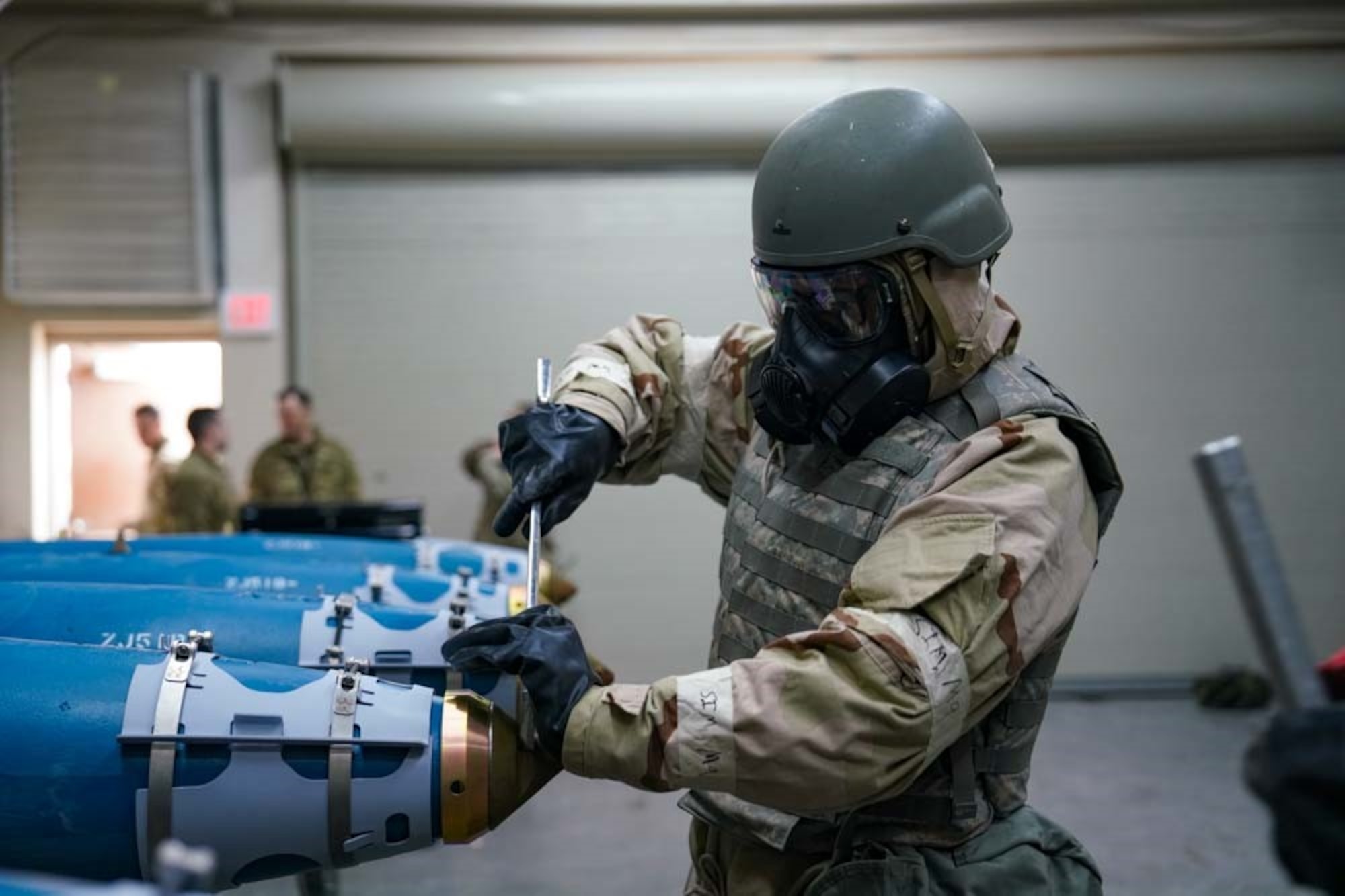 U.S. Air Force Staff Sgt. Julian Ortiz, 25th Maintanence Squadron conventional maintenance crew chief, secures a component on an inert training munition during exercise Iron Raven at Creech   Air Force Base, Nevada, Nov. 19, 2025.