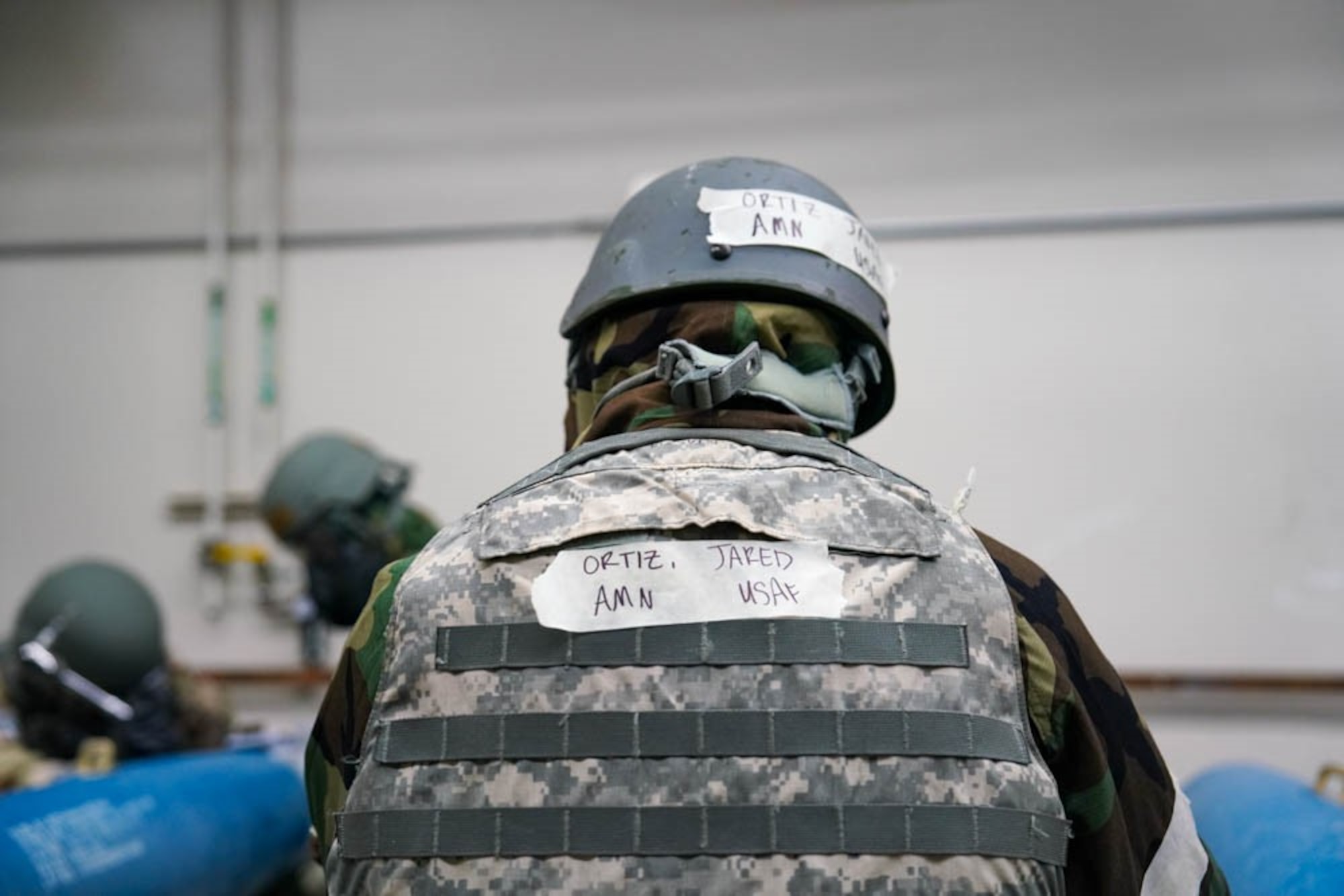 U.S. Air Force Airman Jared Ortiz, 25th Maintenance Squadron conventional maintenance technician, observes airmen during the munitions building exercise Iron Raven at Creech Air Force Base, Nevada, Nov. 19, 2025.