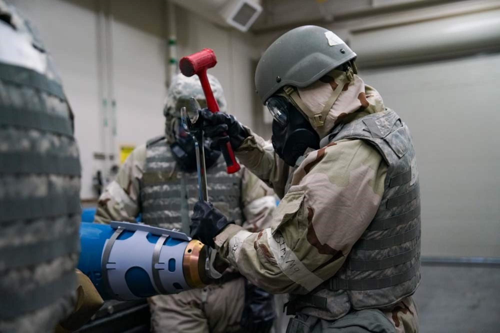 U.S. Air Force Staff Sgt. Julian Ortiz, 25th Maintenance Squadron conventional maintenance crew chief, secures a component on an inert training munition during exercise Iron Raven at Creech Air Force Base, Nevada, Nov. 19, 2025.