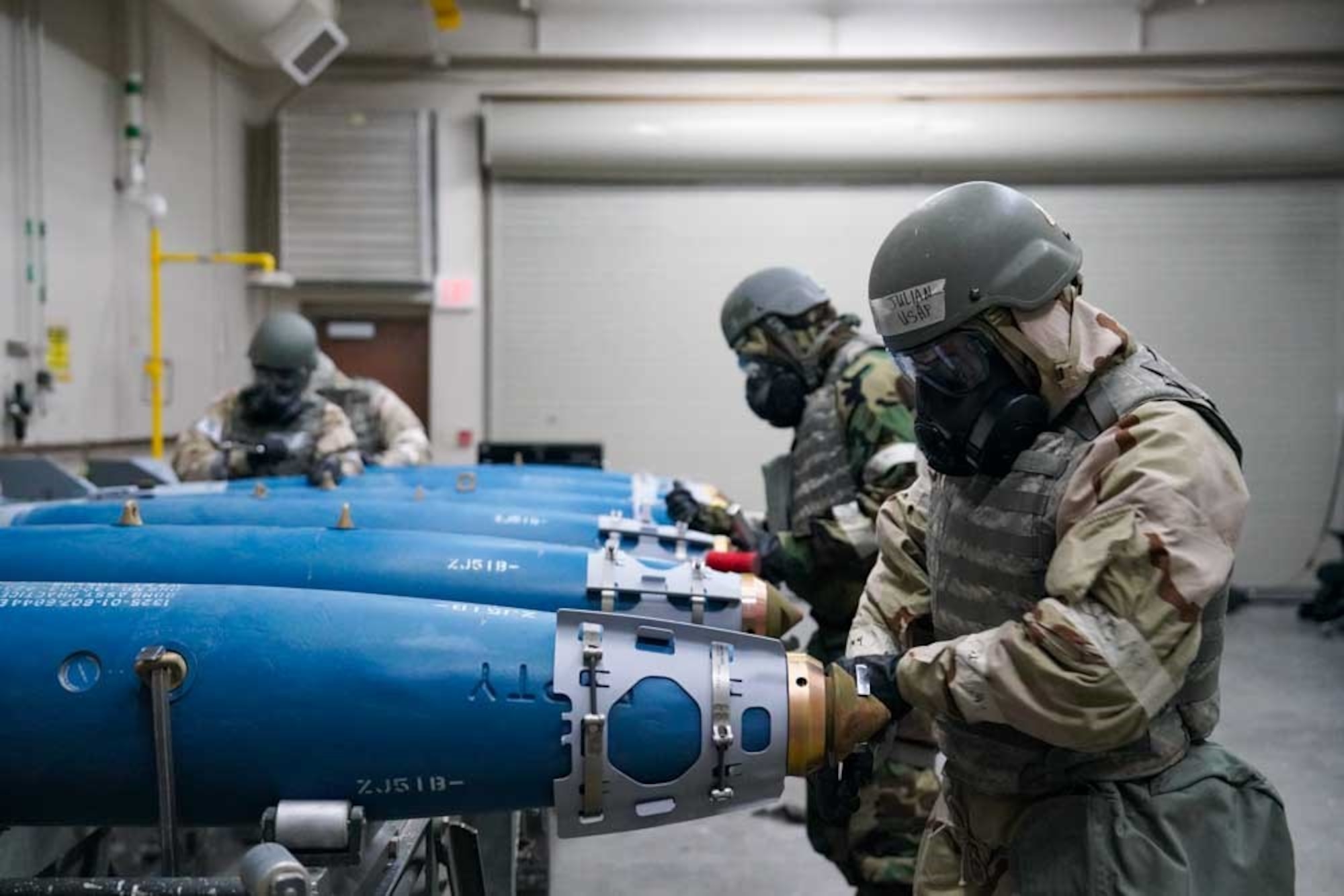 U.S. Air Force Staff Sgt. Julian Ortiz, 25th Maintenance Squadron conventional maintenance crew chief, secures components on an inert training munition during exercise Iron Raven at Creech  Air Force Base, Nevada, Nov. 19, 2025.
