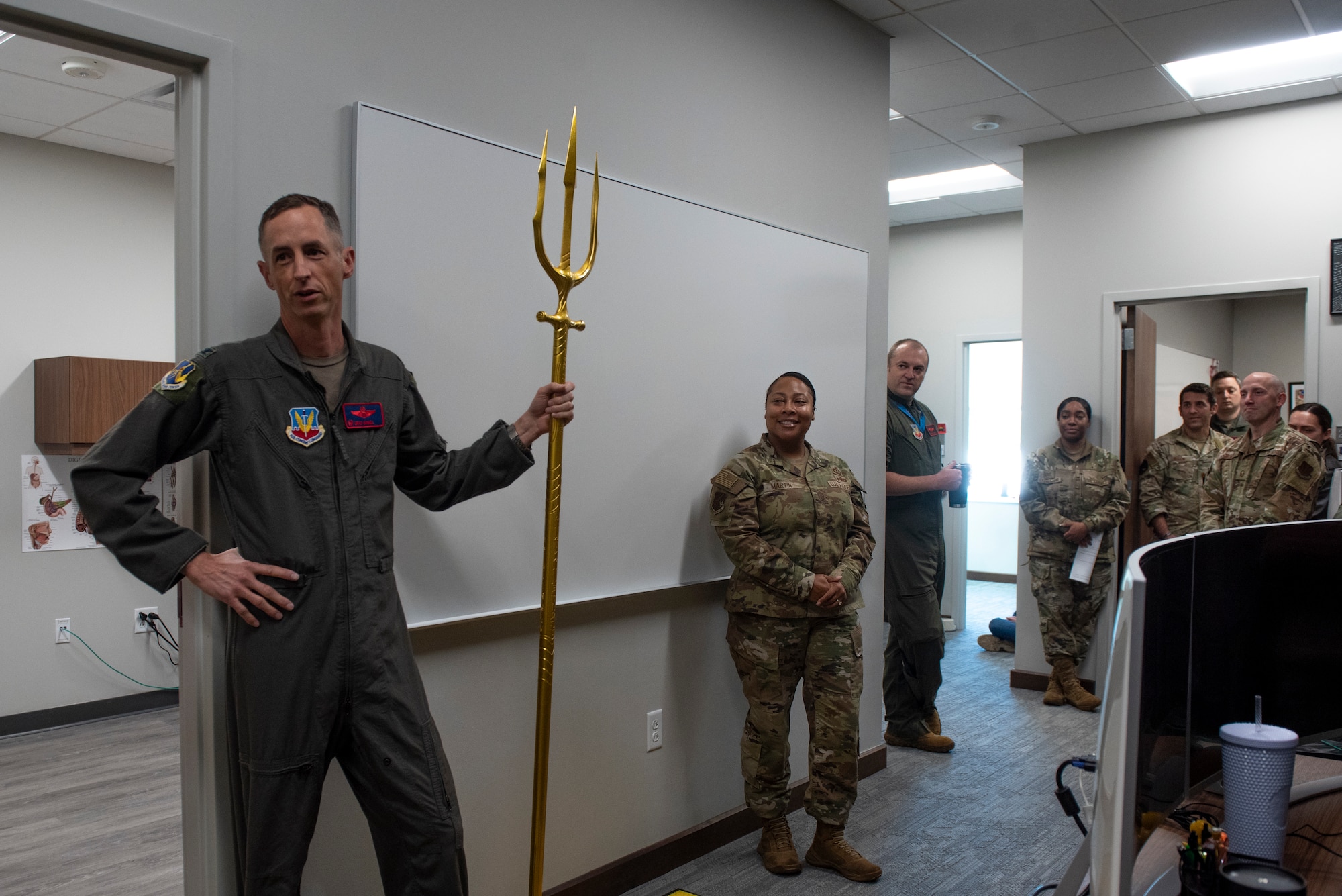 U.S. Air Force Col. Brad Howell, 25th Attack Wing commander, left, presents closing comments during a ribbon cutting ceremony for the 25th ATKW Human Performance Team’s exam room at Shaw Air Force Base, S.C., Nov. 4, 2025.