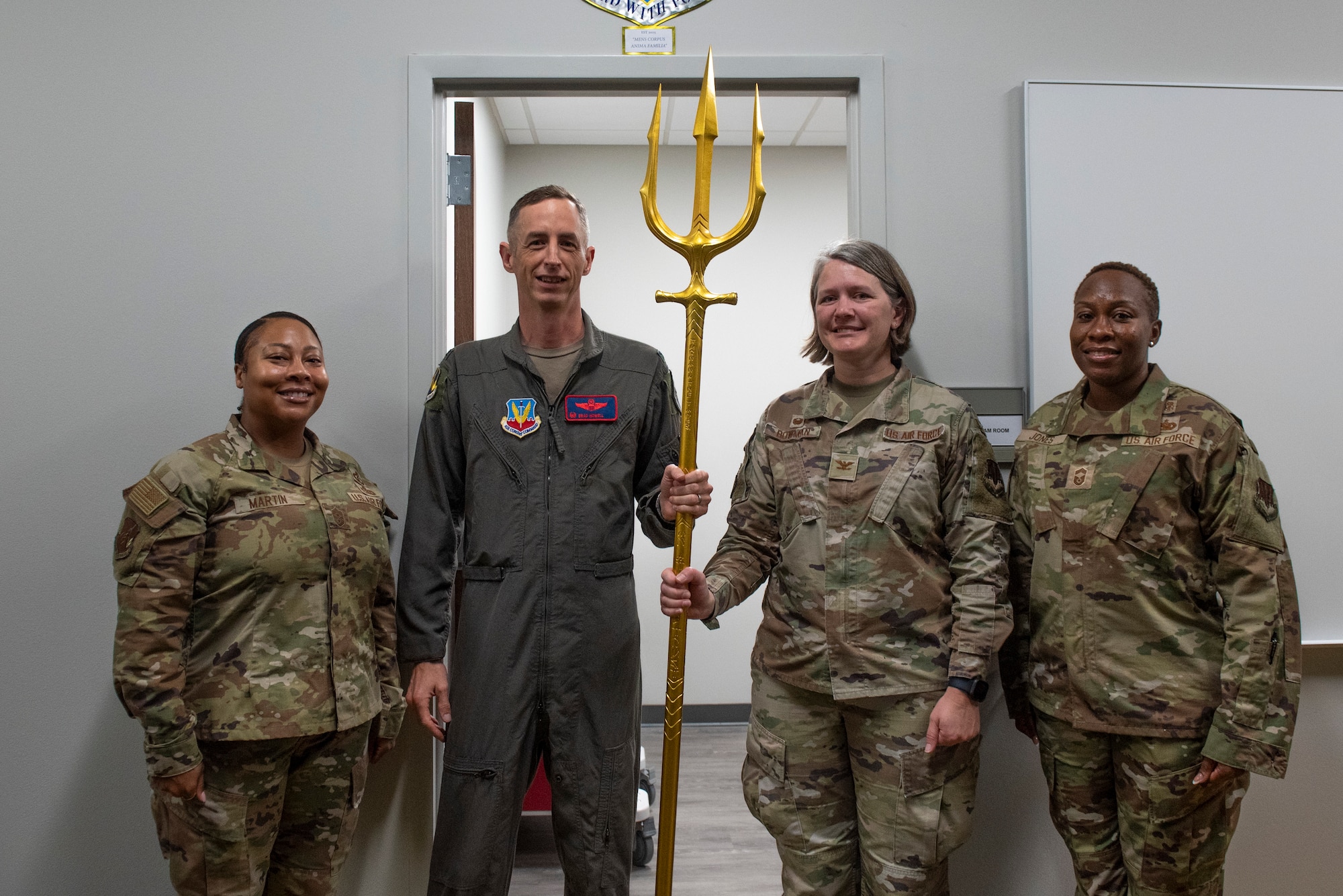 From the left, U.S. Air Force Chief Master Sgt. Joanna Martin, 25th Attack Wing command chief, Col. Brad Howell, 25th ATKW commander, Col. Elizabeth Bowman, 20th Medical Group commander, and Chief Master Sgt. Kalin Jones, 20th MDG senior enlisted leader, pose for a photo during a ribbon cutting ceremony for the 25th ATKW Human Performance Team’s exam room at Shaw Air Force Base, S.C., Nov. 4, 2025.