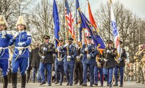 Michigan National Army and Air Guard members, along with other services, represent the United States of America at the Latvian Centennial Parade in Riga, Latvia Sunday, Nov. 18, 2018.