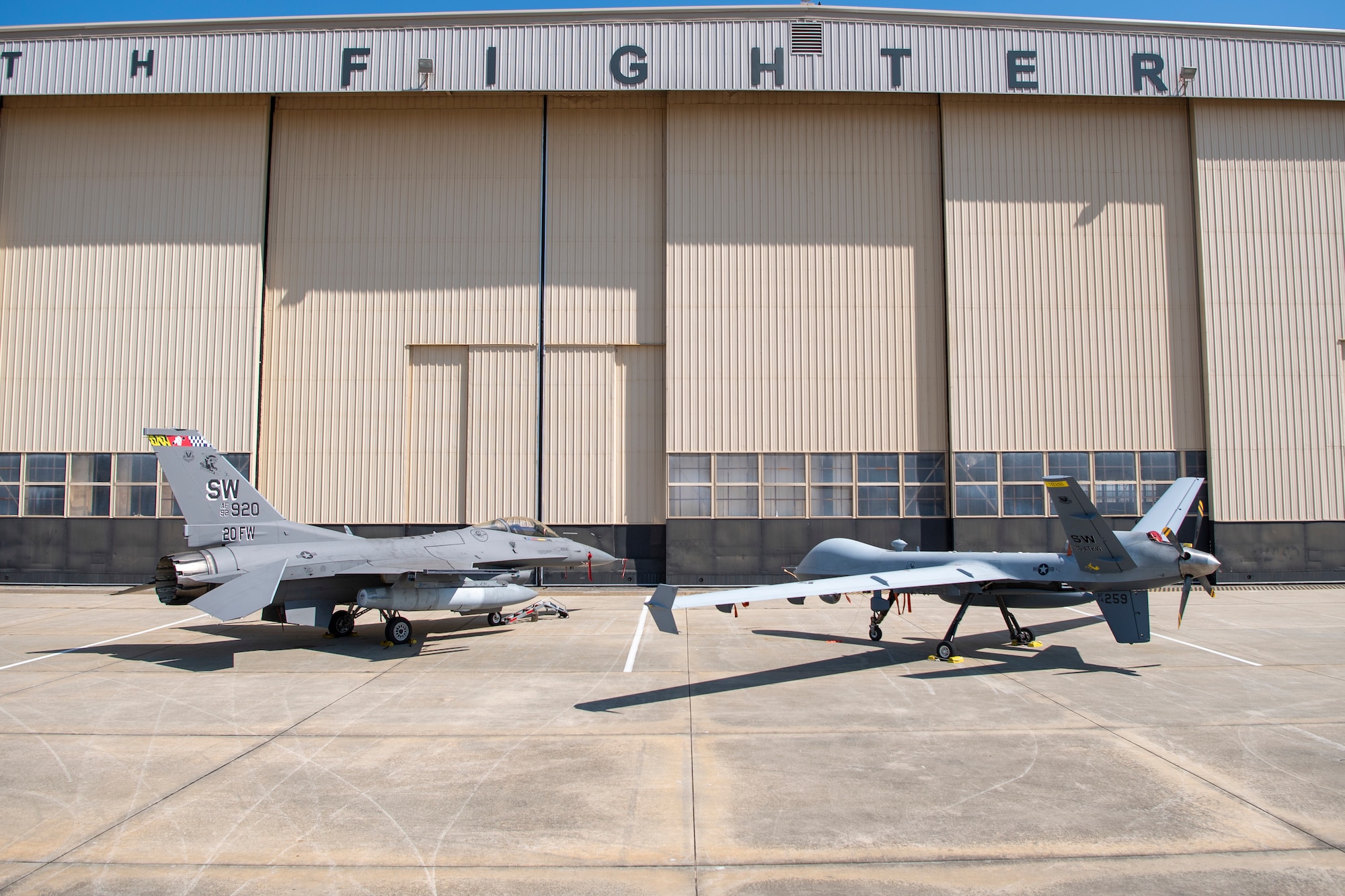 A U.S. Air Force F -16 Fighting Falcon and MQ-9 Reaper sit on the flightline at Shaw Air Force Base, S.C., Sept. 16, 2025.