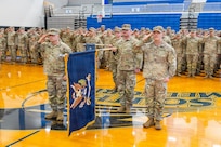 Lt. Col. Joshua Rapp, left, commander of the 1st Battalion, 186th Infantry Regiment, and Command Sgt. Maj. Evan Garner render honors during the national anthem at a demobilization ceremony at South Medford High School in Medford, Oregon, Jan. 11, 2026.