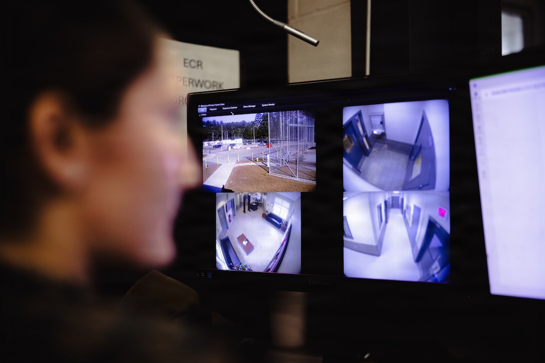 U.S. Marine Corps Lance Cpl. Mayli Motter, a facilities escort with the Marine Corps Installations East-Marine Corps Base (MCB) Camp Lejeune Regional Brig, looks over security cameras on MCB Camp Lejeune, Dec. 15, 2025. The brig is a continuous operation, run 24 hours a day, including all holidays and weekends. (U.S. Marine Corps photo by Cpl. Loriann Dauscher)