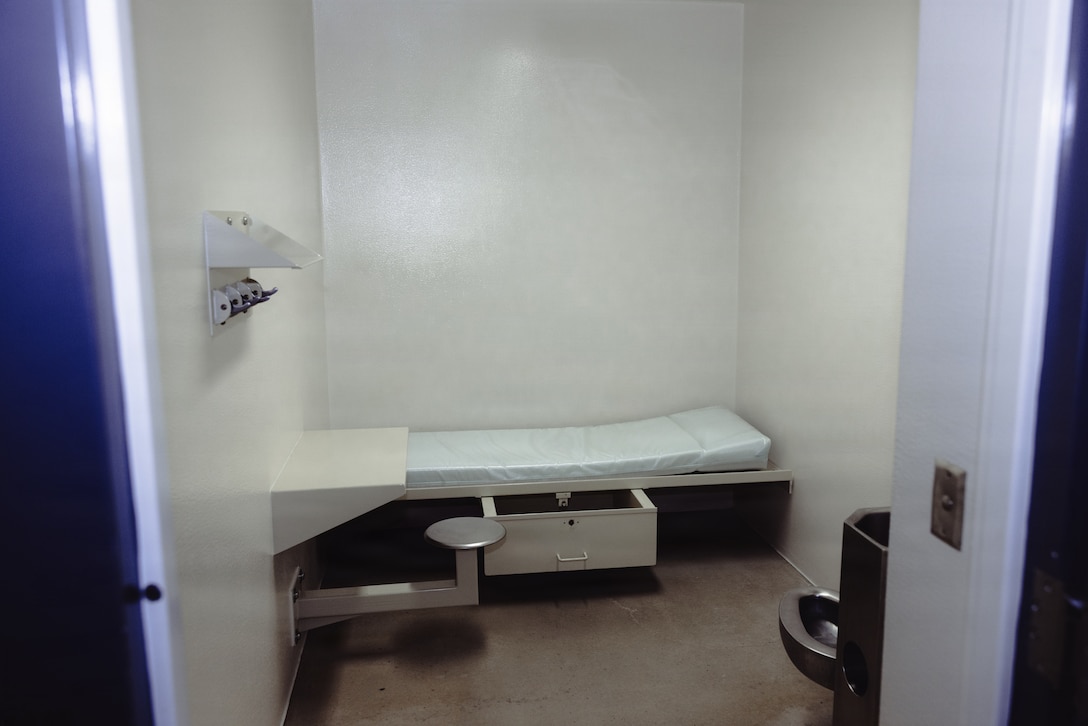 A toilet, seat and bed sit inside of a prison cell at the Marine Corps Installations East-Marine Corps Base (MCB) Camp Lejeune Regional Brig, MCB Camp Lejeune, Dec. 15, 2025. Most of the day, the prisoners are allowed outside of their cells in the open floor area. (U.S. Marine Corps photo by Cpl. Loriann Dauscher)
