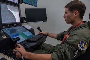 U.S. Air Force Senior Airman Nathan Colburn, 482nd Attack Squadron sensor operator instructor, operates an MQ-9 Reaper from a Ground Control Station at Shaw Air Force Base, S.C., Oct. 20, 2025.