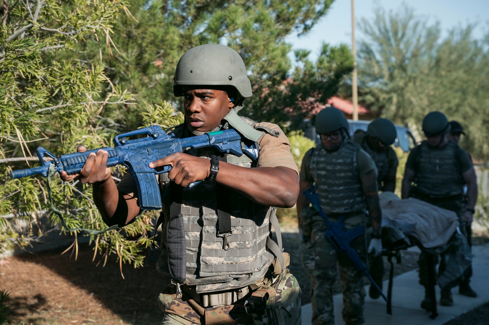 U.S. Air Force Senior Airman Robbie Wallace, a health services management journeyman assigned to the 99th Medical Group, and his team perform a tactical patient movement during the 2025 Diamondback Medic Rodeo at Nellis Air Force Base, Nevada, Dec. 9, 2025.