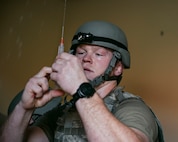 U.S. Air Force Capt. Hunter Brown, a registered nurse assigned to the 99th Medical Group, prepares pain medication for patient care during the 2025 Diamondback Medic Rodeo at Nellis Air Force Base, Nevada, Dec. 9, 2025.