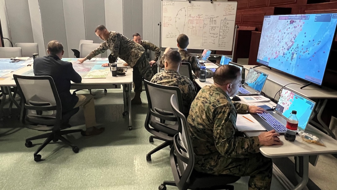 School of Advanced Warfighting students participate in the weekly continuation of a semester-long wargame. Wargaming provides an opportunity to:  practice decision-making in complex scenarios, apply theory to realistic situations, explore multiple perspectives, and analyze consequences. Through roleplay and simulation, students build critical thinking, collaboration, and strategic skills. Shown here in Quantico, Virginia on 17 Dec 2025.