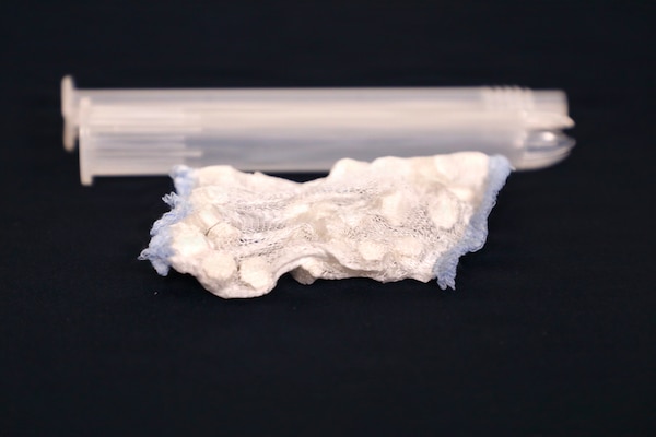 Naval Medical Research Command (NMRC) in partnership with medical device company, RevMedx developed the XSTAT P15, an advanced hemostatic device designed to control hemorrhaging. This device is supplied in two easy to use pieces, the plunger and barrel. The barrel houses a pouch of miniature sponges that will rapidly expand to fill the wound site and control hemorrhaging. This device requires no training to be applied effectively and efficiently in emergent situations. Navy Medicine Research & Development, is engaged in a broad spectrum of activity from basic science in the laboratory to field studies in austere and remote areas of the world to investigations in operational environments. In support of Navy, Marine Corps and joint U.S. warfighter health, readiness and lethality, researchers study infectious diseases, biological warfare detection and defense, combat casualty care, environmental health concerns, aerospace and undersea medicine, operational mission support and epidemiology. (U.S. Navy photo by Aleece Williams/Released)