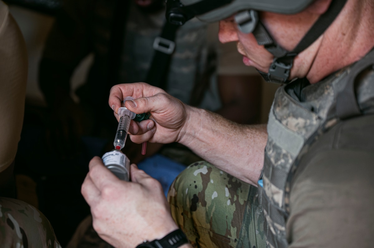 U.S. Air Force Capt. Hunter Brown, a registered nurse assigned to the 99th Medical Group, prepares pain medication for patient care during the 2025 Diamondback Medic Rodeo at Nellis Air Force Base, Nevada, Dec. 9, 2025.