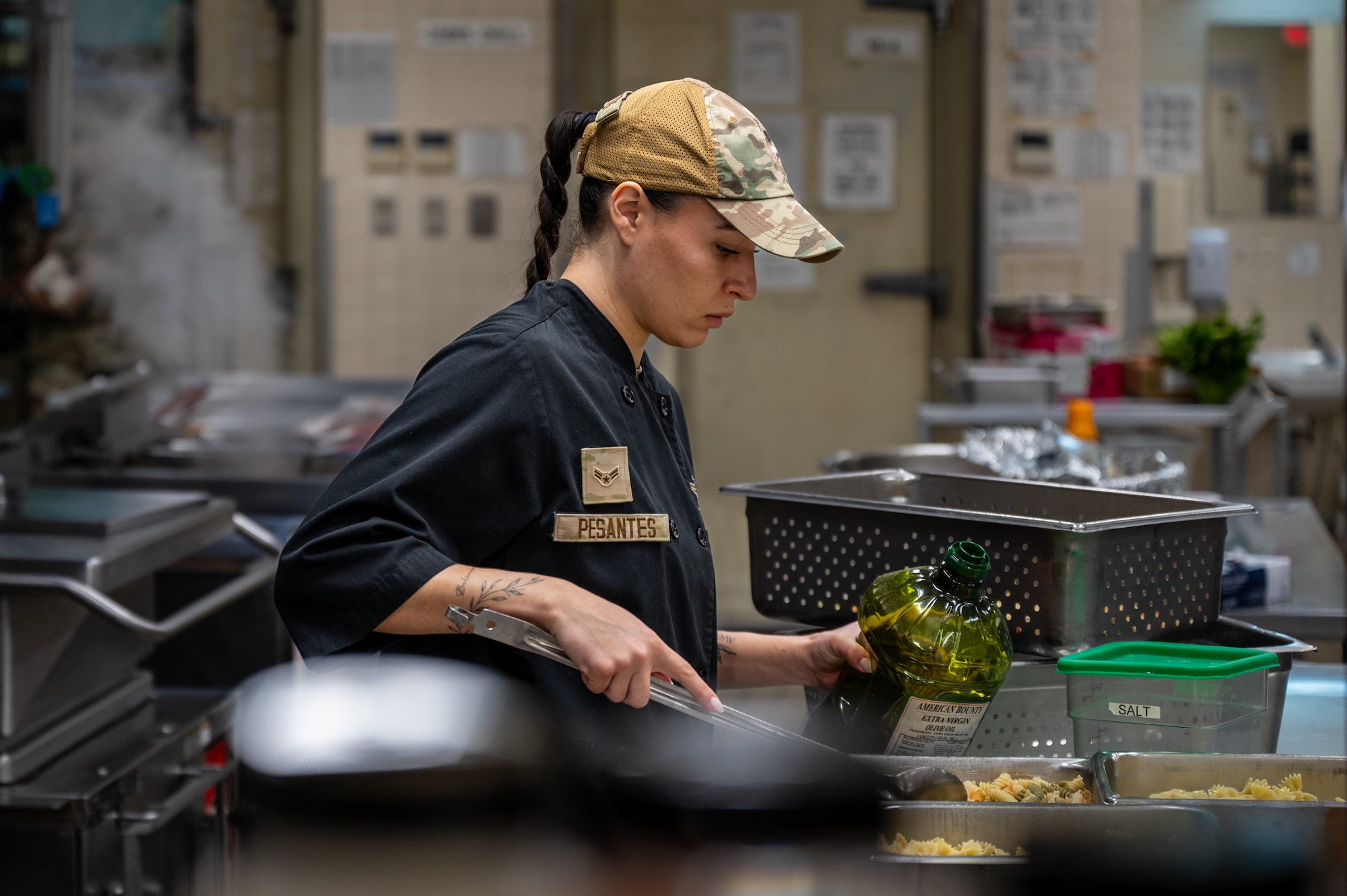 U.S. Air Force Airman 1st Class Jocelyne Pesantes, 718th Force Support Squadron food service member, prepares pasta ahead of meal service at the Marshall Dining Facility at Kadena Air Base, Japan, Jan 8, 2026. Early preparation supports efficient operations while serving hundreds of meals daily. (U.S. Air Force photo by Airman 1st Class Francisco Huerta)