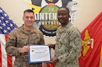 Lt. Najib Adamu, department head for Naval Medical Center Camp Lejeune Blood Services, presents an Armed Services Blood Program Certificate of Appreciation to 2nd Maintenance Battalion Operations Officer Maj. Daniel Arft. ASBP is the official blood provider for the United States military, tasked with a vital, life-saving mission: to supply quality blood products to service members and their families across the globe, in times of both peace and war.