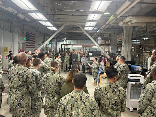 SAN DIEGO (Dec. 9, 2025) – Capt. Elizabeth Adriano, Naval Medical Center San Diego director, delivers remarks to members of the Medical Logistics department during an awards ceremony. The MEDLOG department was awarded the Commander's Cup, 4th Quarter, FY25, in recognition of its critical support services role, ensuring that the hospital has the necessary supplies and equipment to deliver exceptional patient care without interruption. The mission of NMCSD is to provide a superior experience for our patients, staff, and warfighters. NMCSD employs more than 5,000 active-duty military personnel, civilians, and contractors in southern California to deliver exceptional care afloat and ashore.
