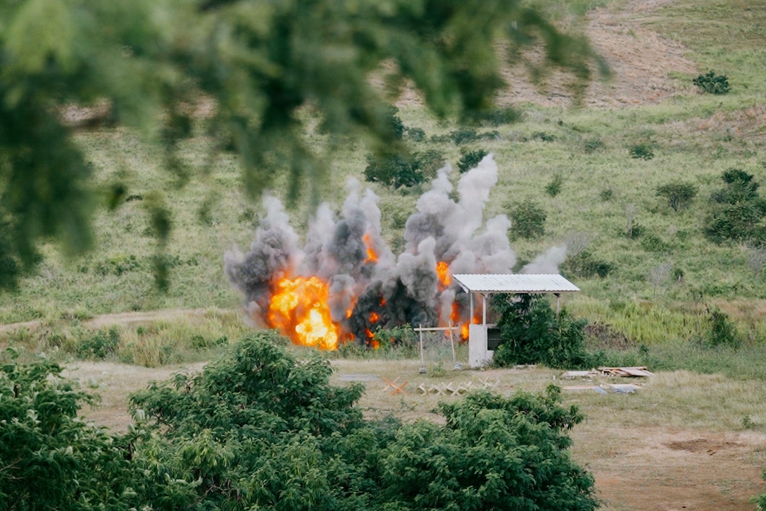 U.S. Marine Corps combat engineers with Battalion Landing Team 3/6, 22nd Marine Expeditionary Unit (Special Operations Capable), detonate a charge during a demolition range on Camp Santiago, Puerto Rico, Dec. 9, 2025. U.S. military forces are deployed to the Caribbean in support of the U.S. Southern Command mission, Department of War-directed operations, and the president's priorities to disrupt illicit drug trafficking and protect the homeland. (U.S. Marine Corps photo)