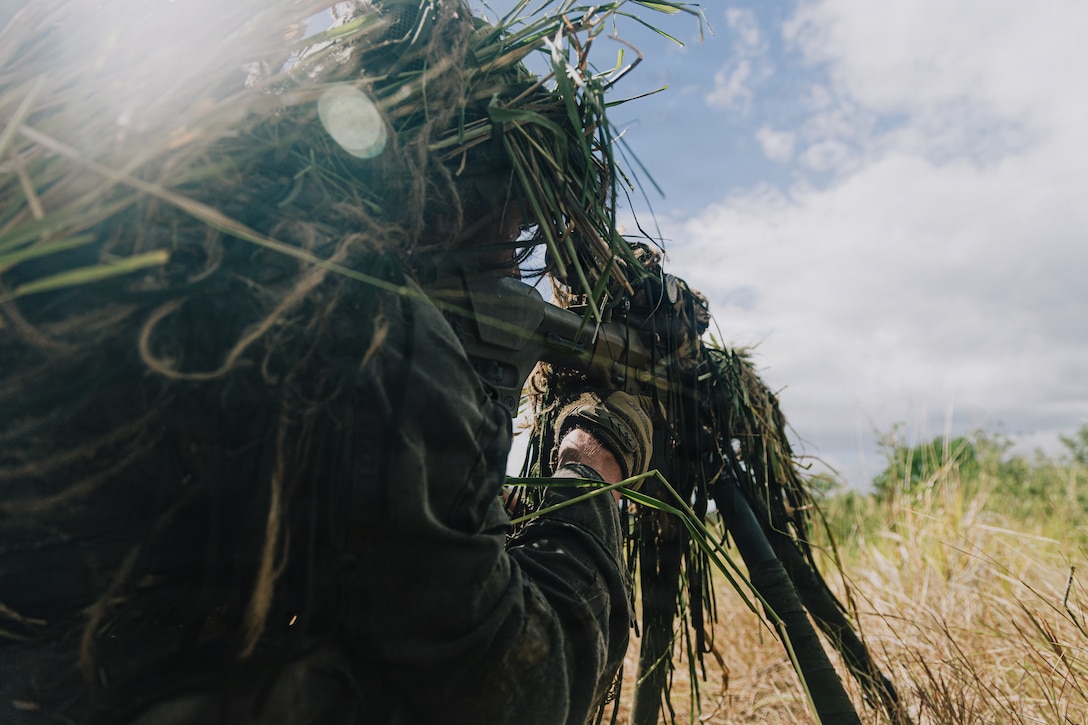 A U.S. Marine Corps scout sniper with Weapons Company, Battalion Landing Team 3/6, 22nd Marine Expeditionary Unit (Special Operations Capable), sights in with an M110 semi-automatic sniper system during a stalk lane exercise on Camp Santiago, Puerto Rico, Dec. 22, 2025. U.S. military forces are deployed to the Caribbean in support of the U.S. Southern Command mission, Department of War-directed operations, and the president's priorities to disrupt illicit drug trafficking and protect the homeland. (U.S. Marine Corps photo)