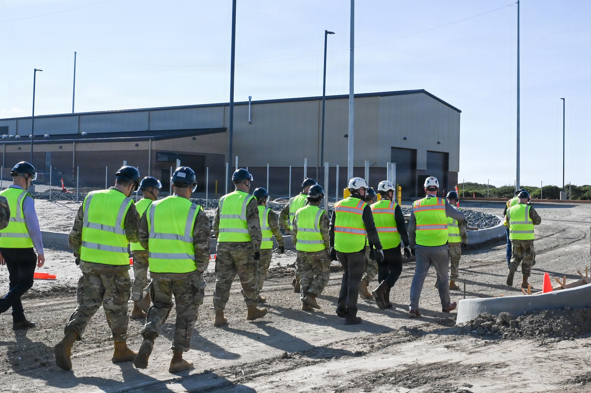 People stand outside.