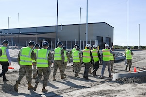 People stand outside.