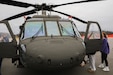 Students from the Arvin Education Center check out the static display of a UH-60 Black Hawk helicopter during a visit to Boone National Guard Center in Frankfort, Kentucky, Jan. 6, 2026. The students visited from Oldham County to explore military careers the medical field. (U.S. Army National Guard photo by Sgt. 1st Class Benjamin Crane)