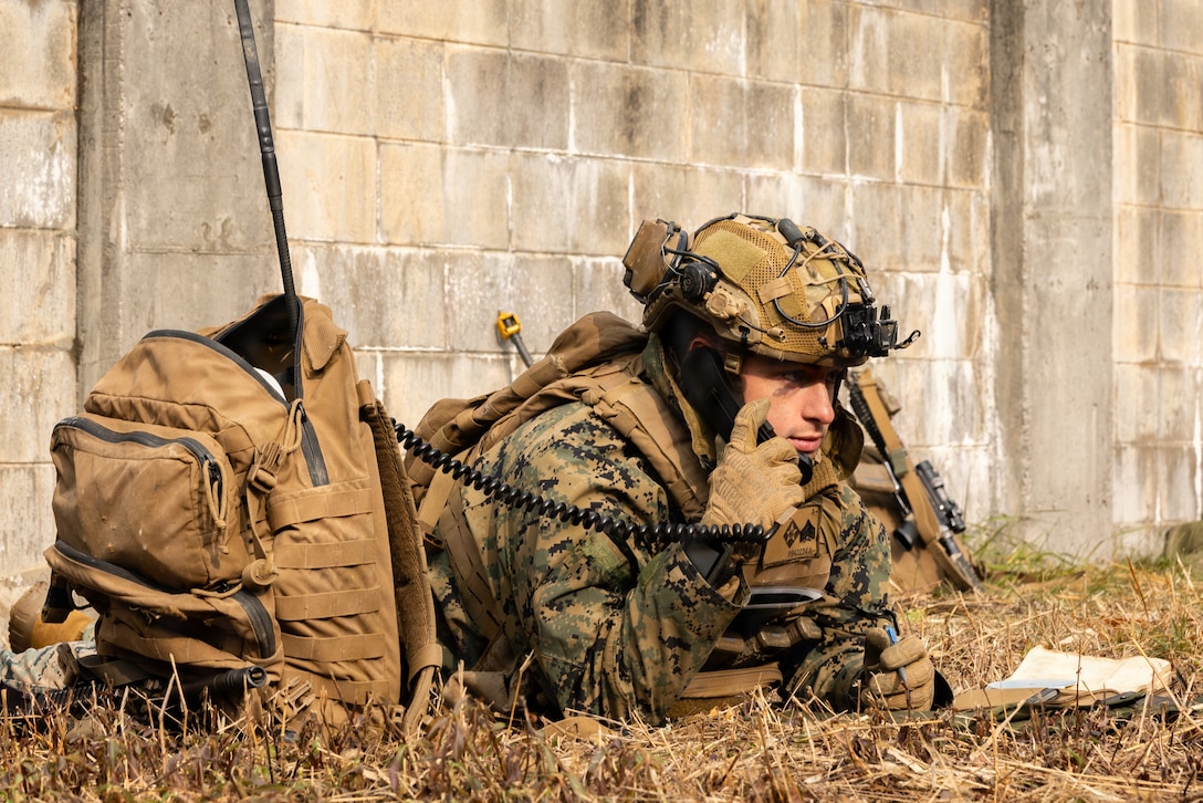 U.S. Marine Corps Sgt. Estevan Diaz, a mortarman with 1st Battalion, 6th Marines, forward deployed with 4th Marine Regiment, 3rd Marine Division as part of the Unit Deployment Program, checks his radio while conducting platoon attacks in an urban environment during Korea Viper 26.1 at Camp Rodriguez, South Korea, Dec. 17, 2025.